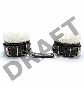 Изысканные чёрные наручники с белым кружевом